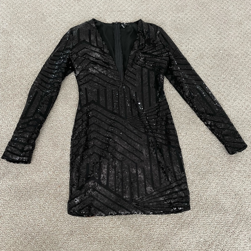 Long sleeve black sequin dress with plunging neckline